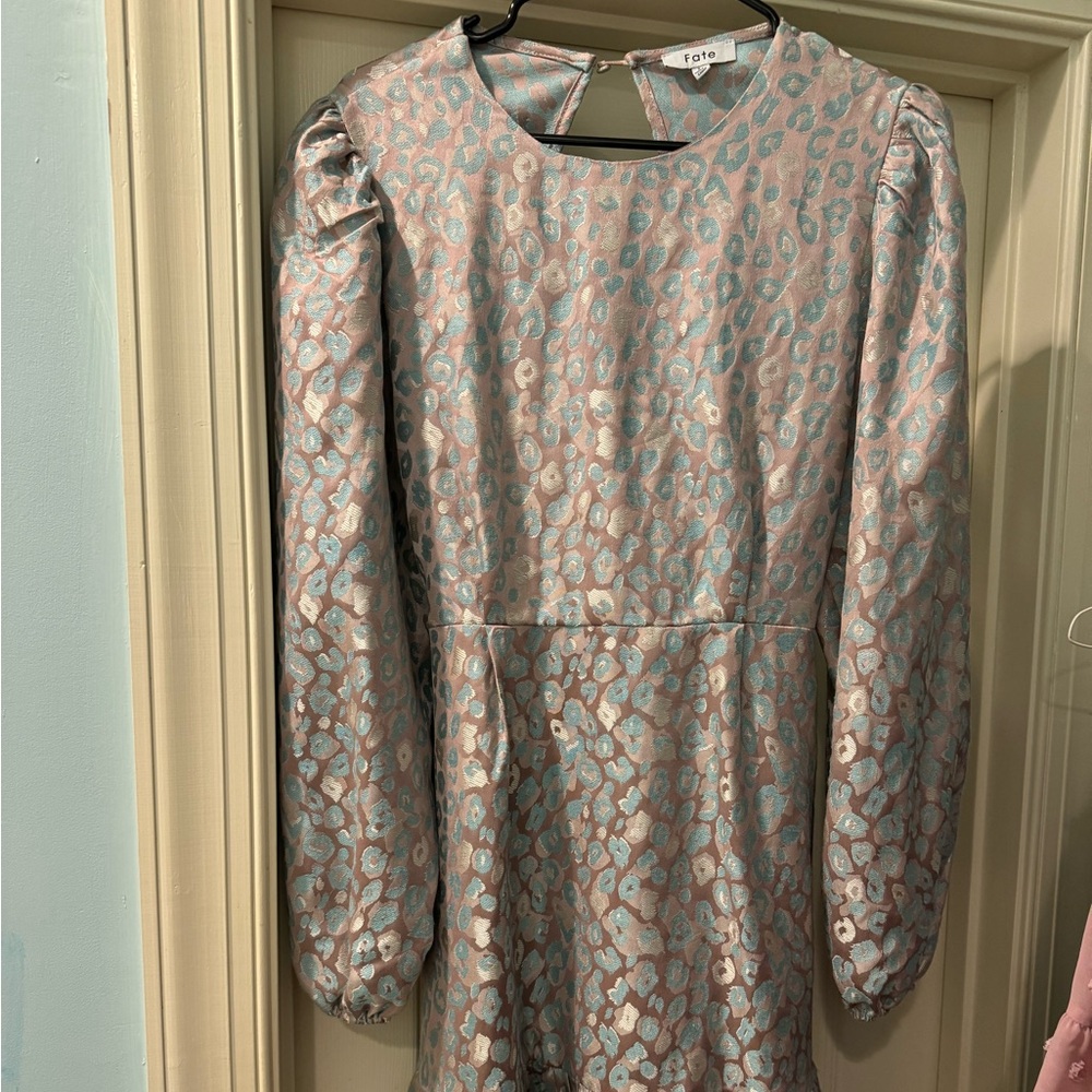 Absolutely beautiful. Subtle cheetah print. Back is open with fun bow.
